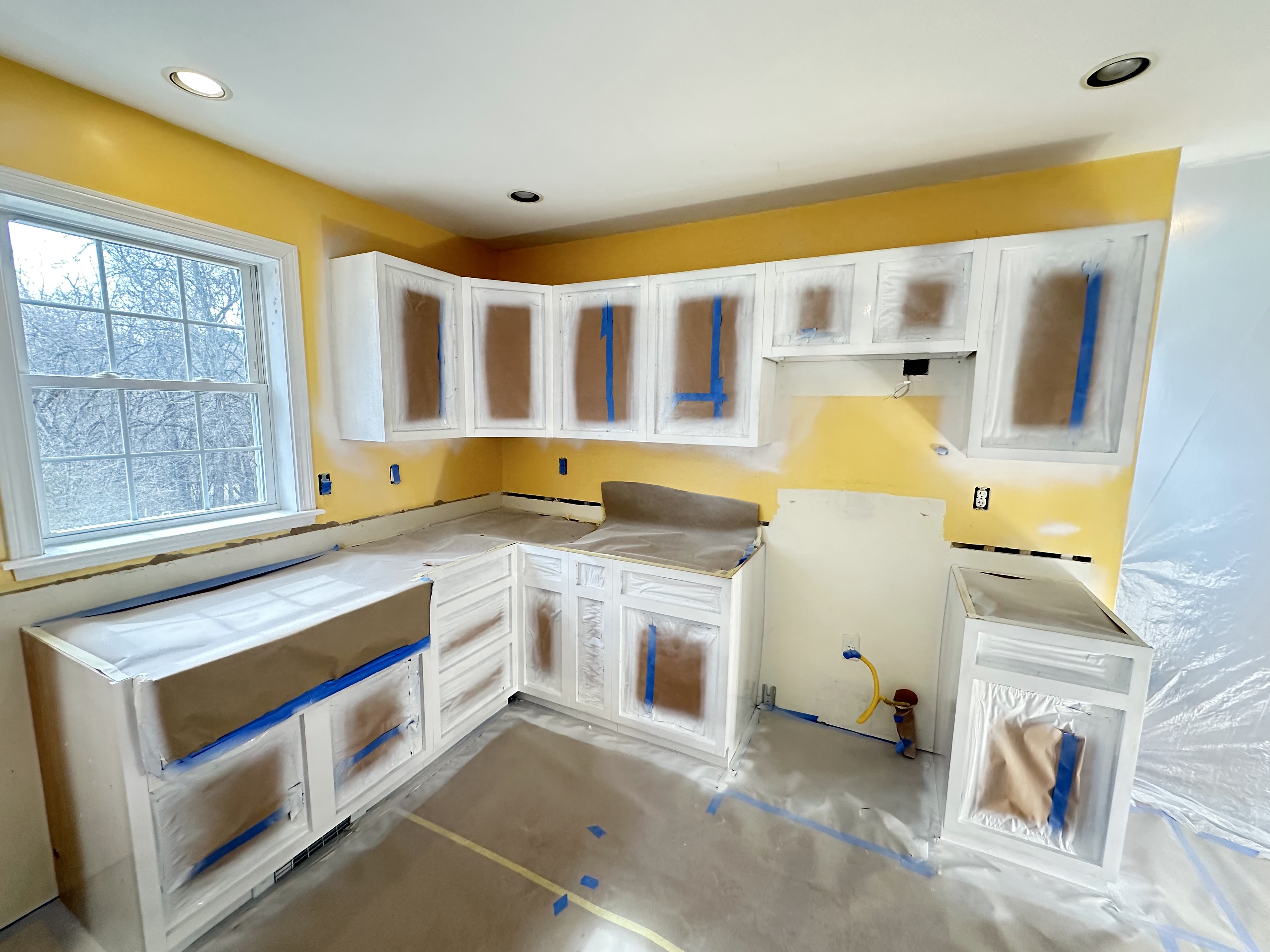 Cabinet doors and drawer fronts painted and reinstalled