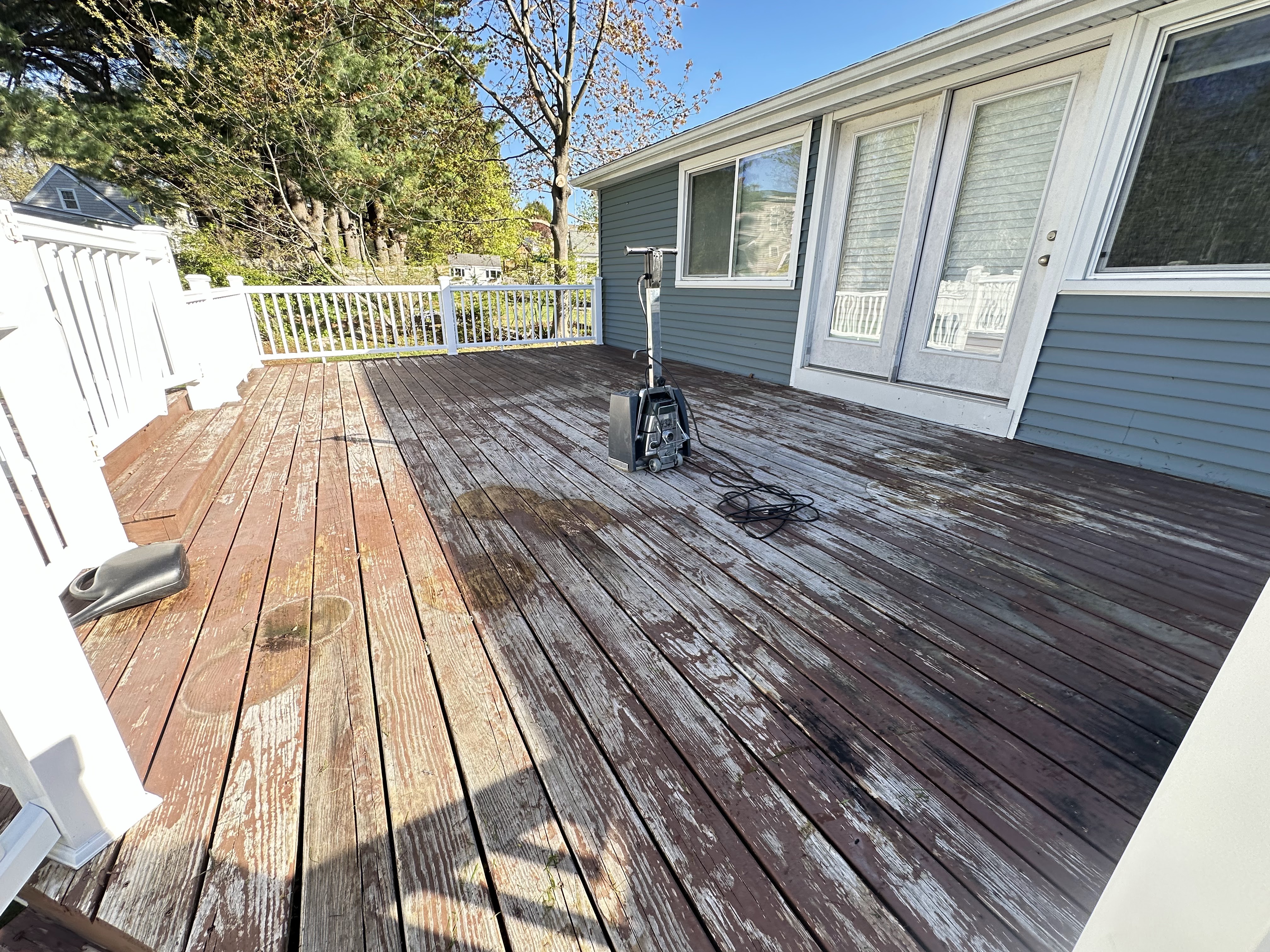 Fence staining or painting for refreshed curb appeal and weather protection