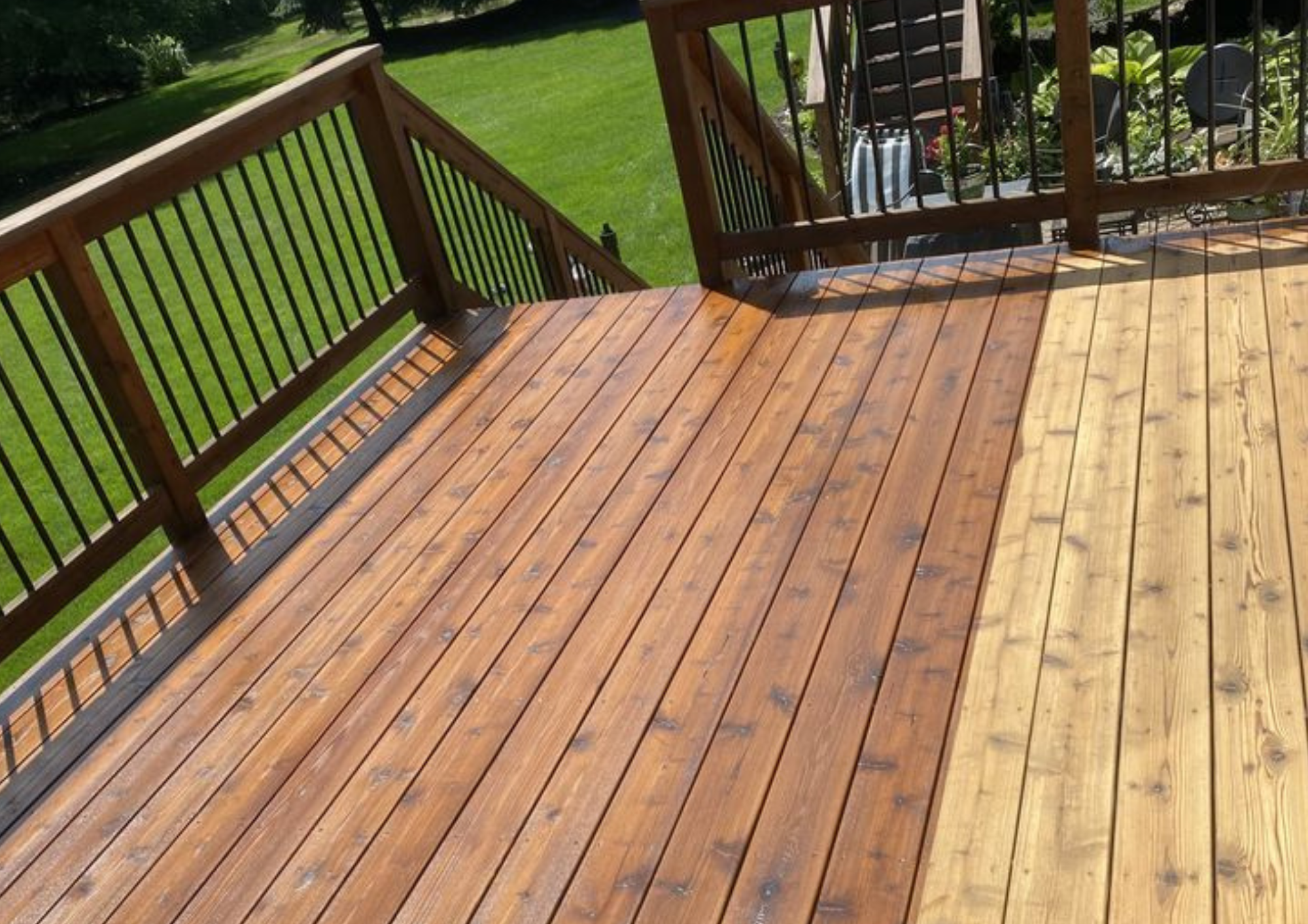 Freshly refinished outdoor deck with clean wood tone and railings