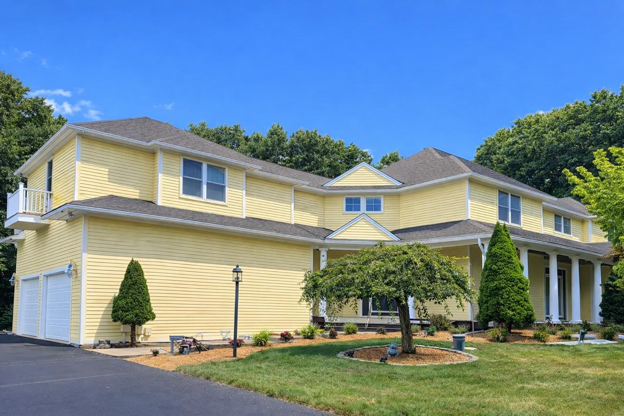 Modern exterior repaint with smooth siding finish and updated palette