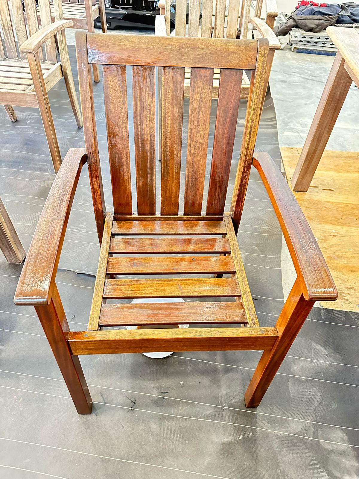 Close-up of smooth, freshly stained deck boards and railing