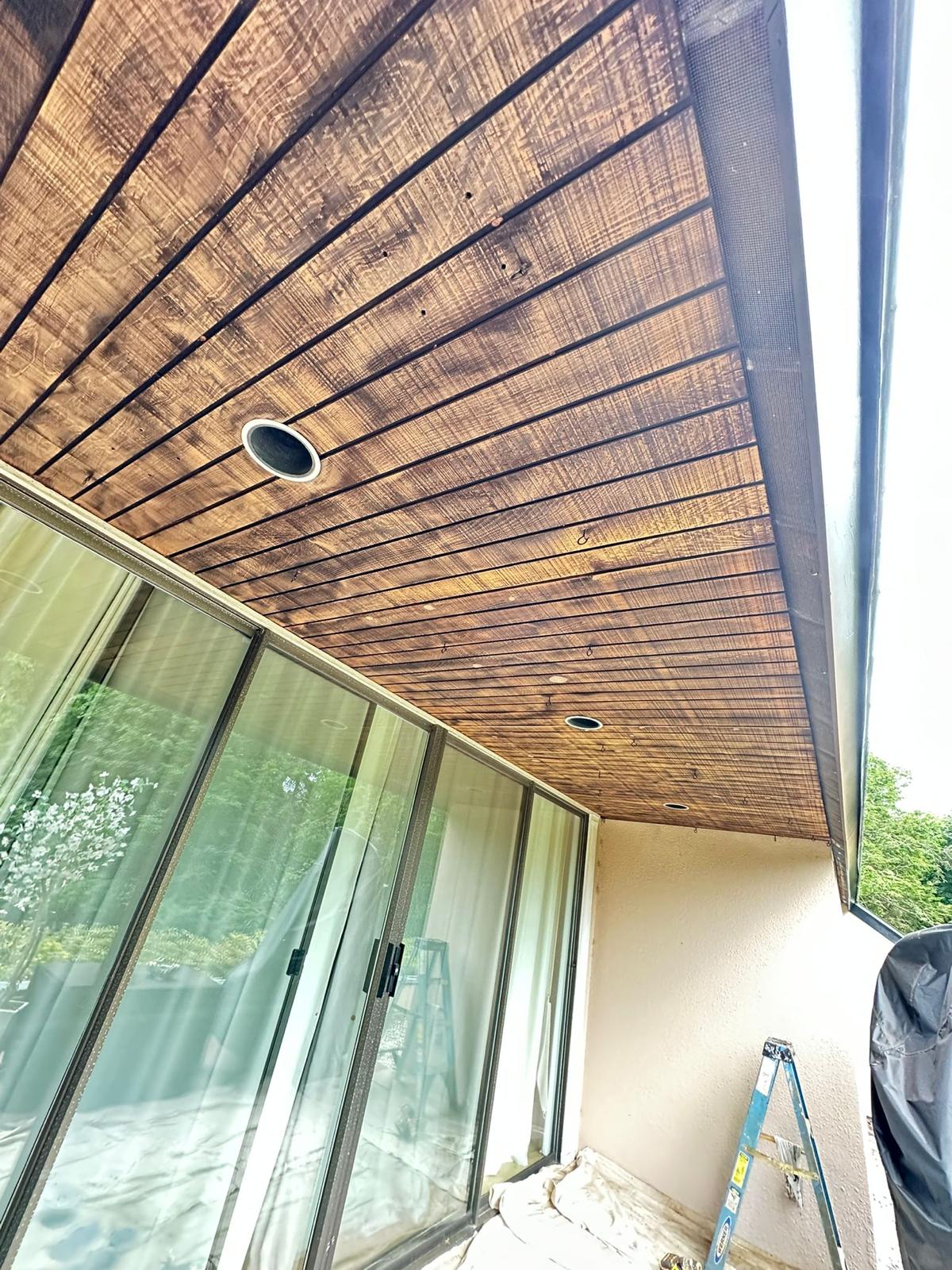 Fence staining project with uniform natural wood tone