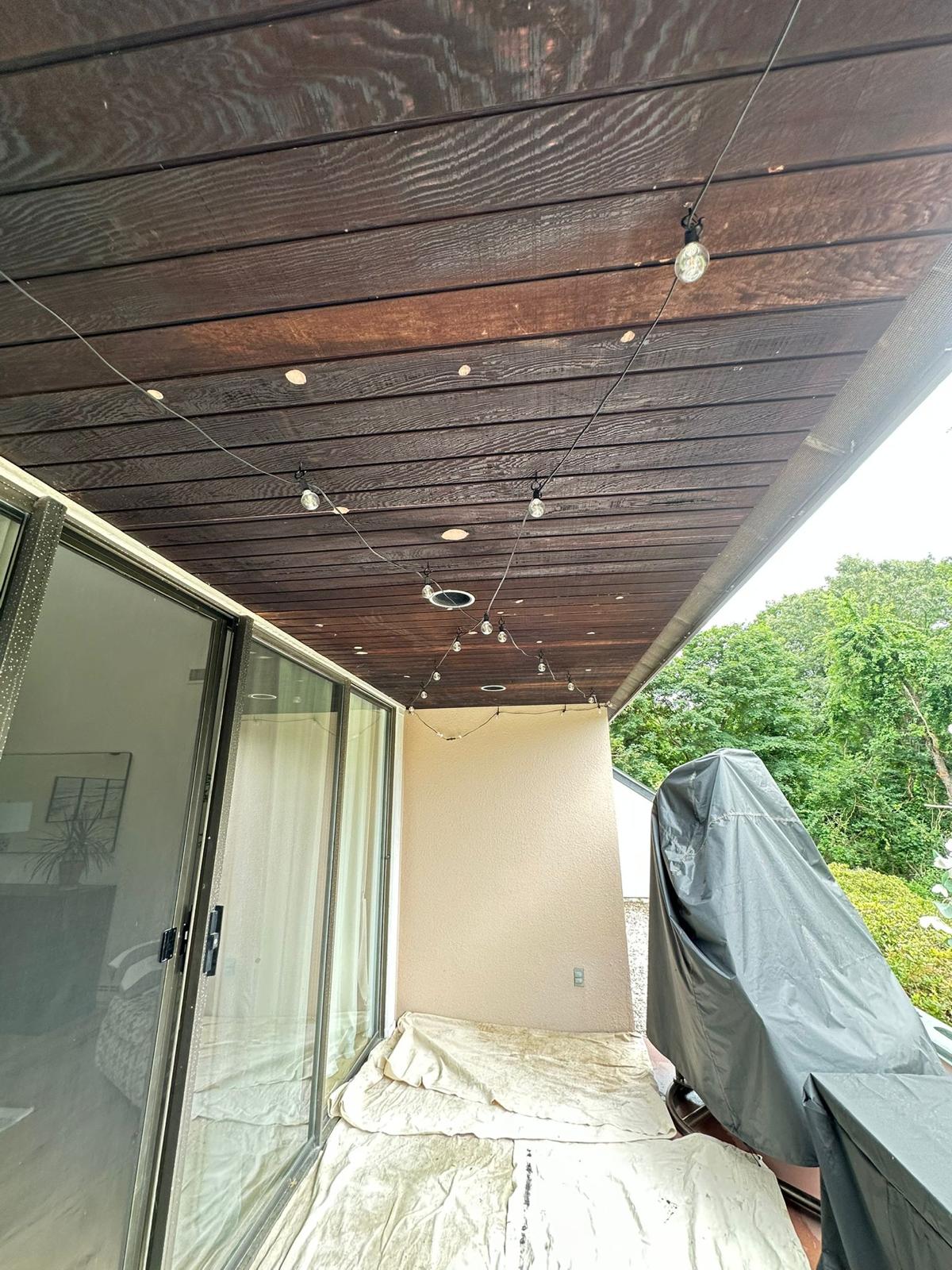 Fence staining project with uniform natural wood tone