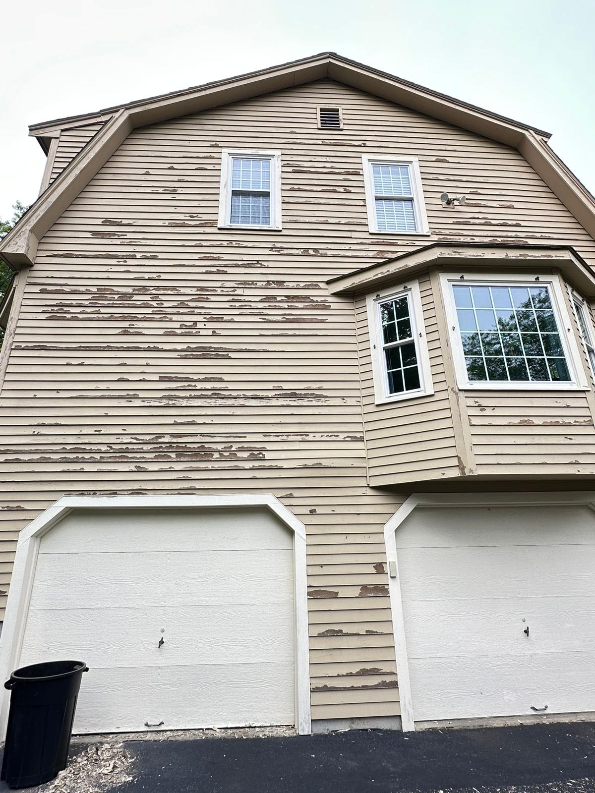 Fence staining project with uniform natural wood tone