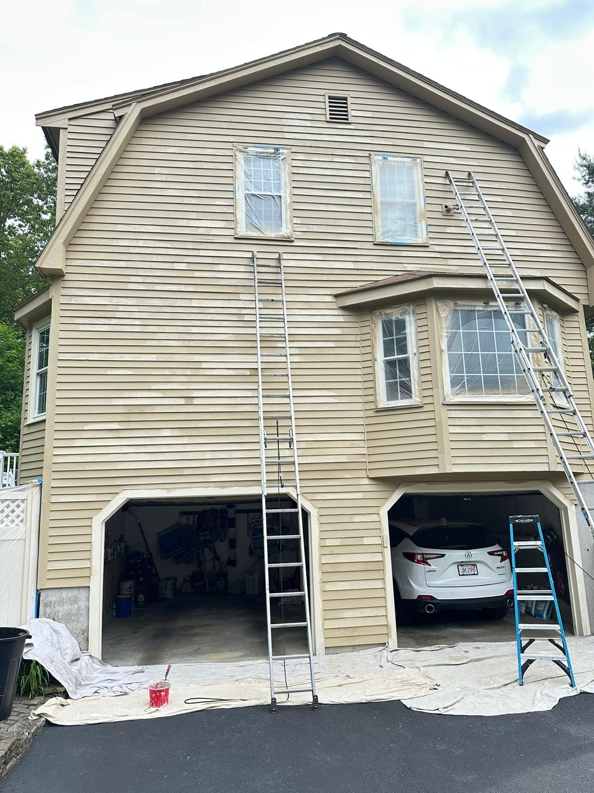Fence staining project with uniform natural wood tone