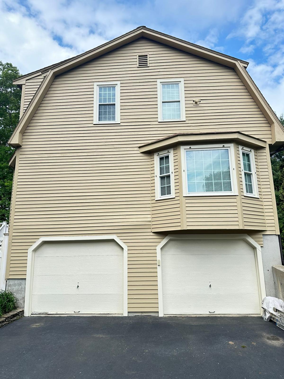 Fence staining project with uniform natural wood tone