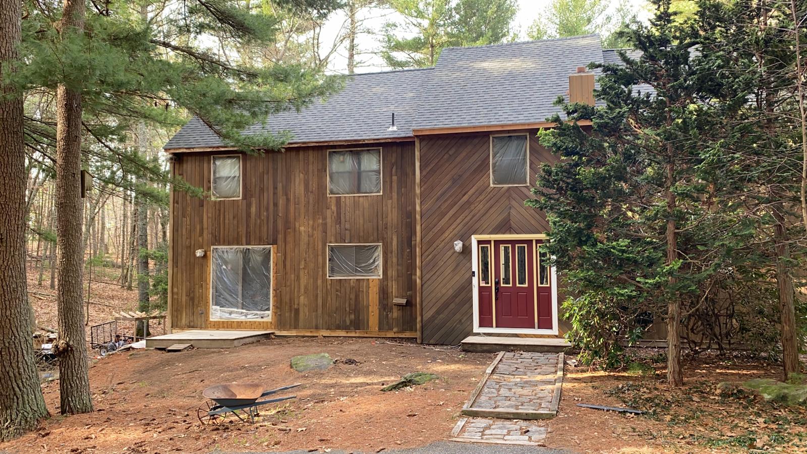 Repainted trim and front door with modern color palette