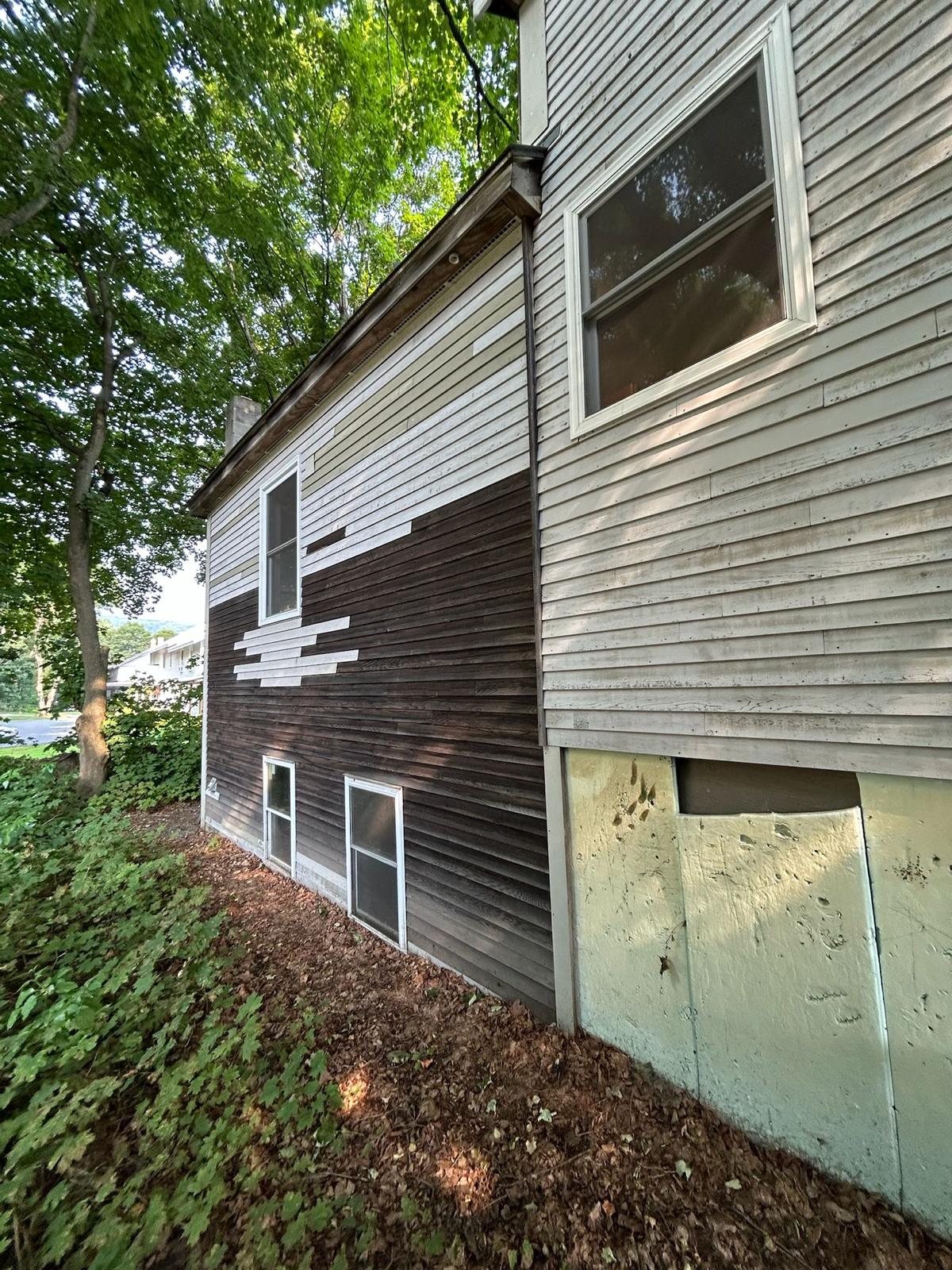Fence staining project with uniform natural wood tone