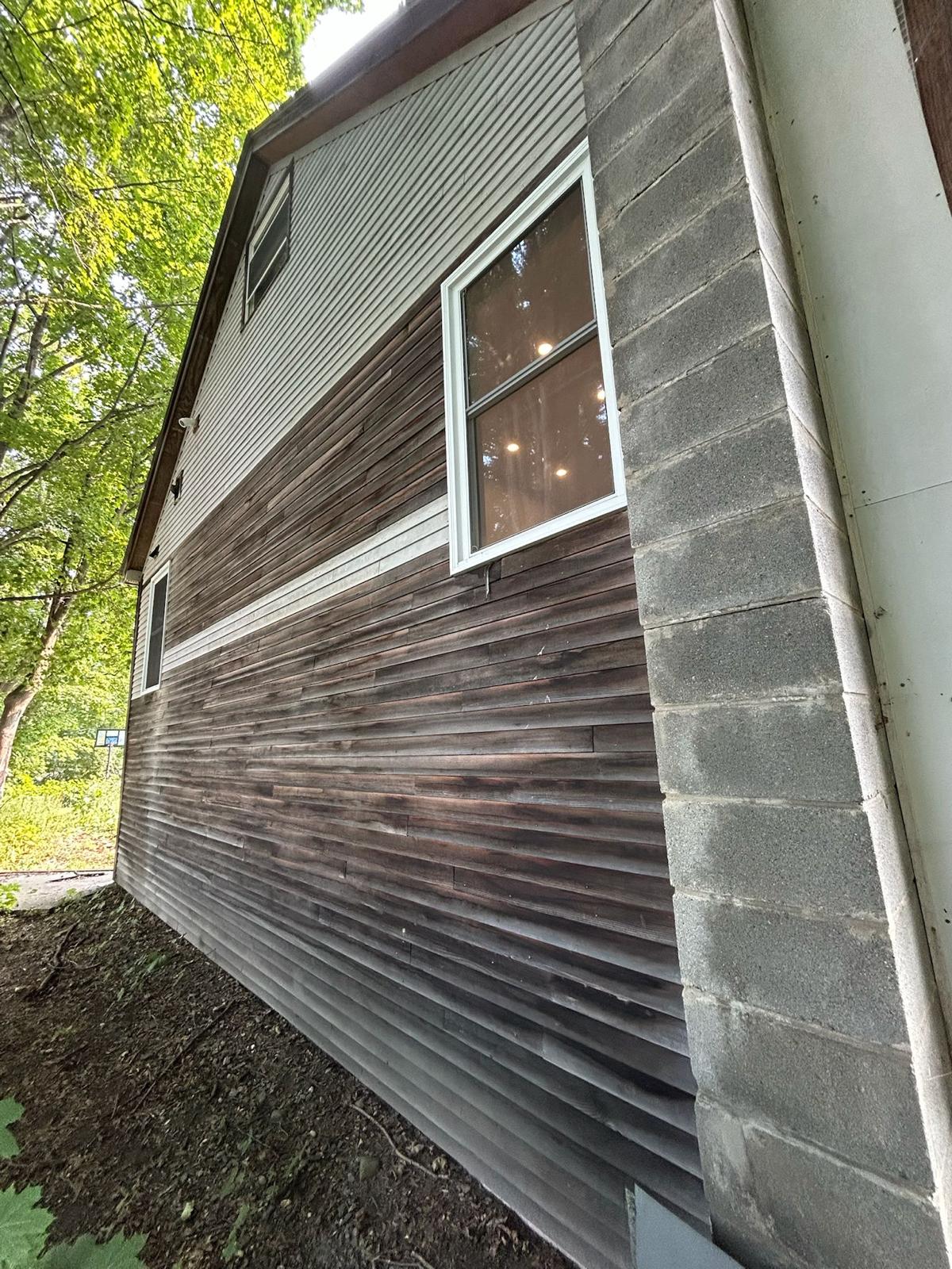 Fence staining project with uniform natural wood tone