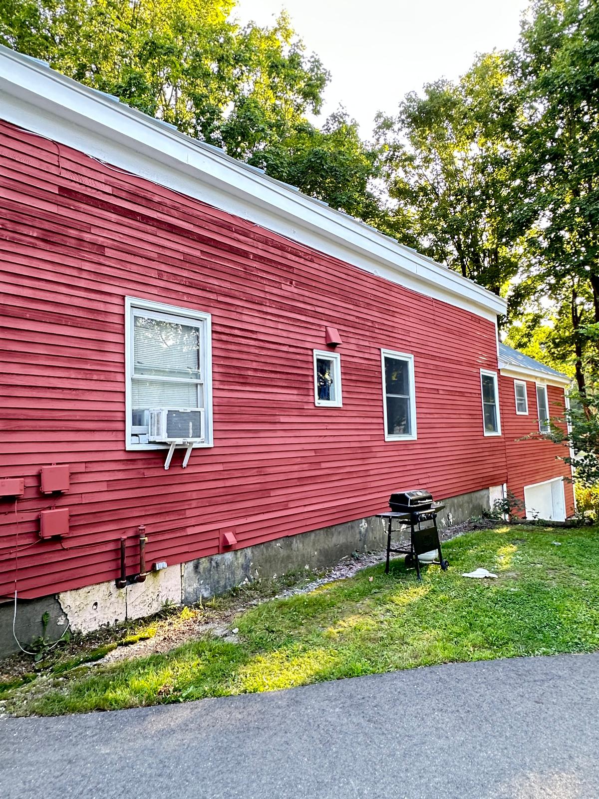 Fence staining project with uniform natural wood tone