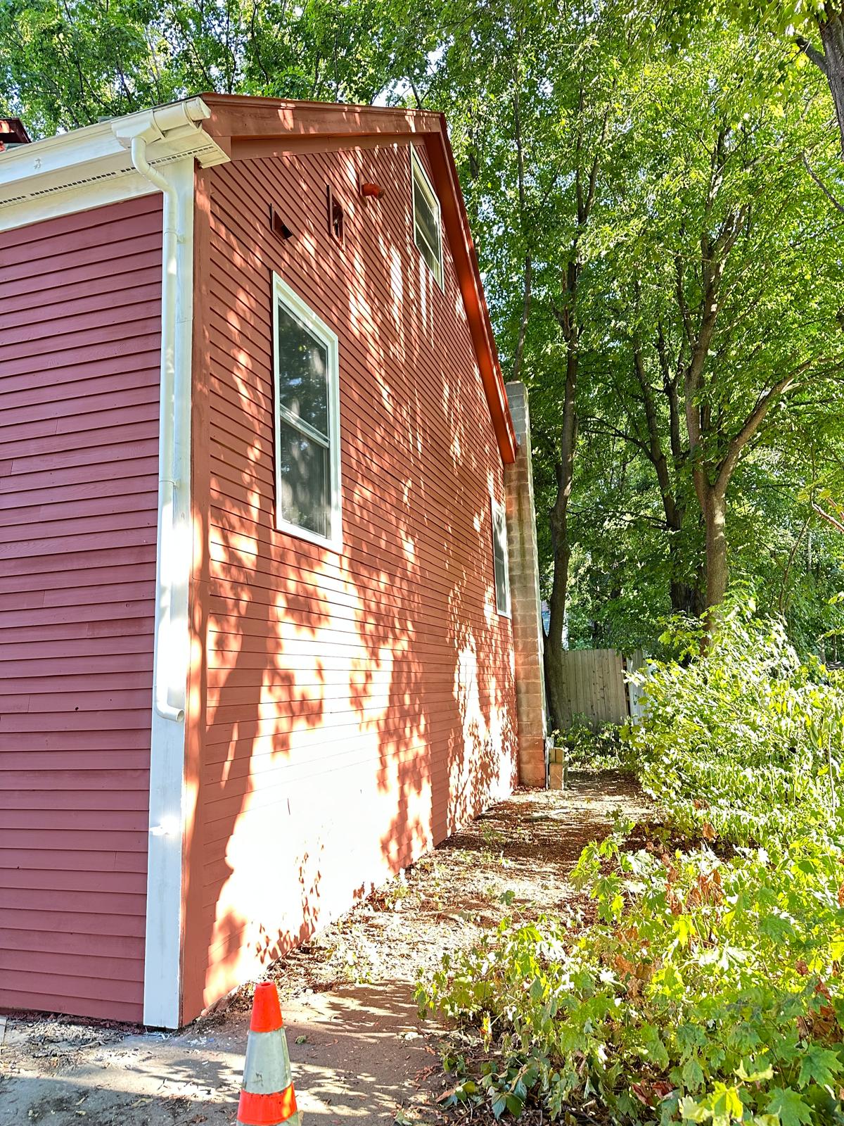 Fence staining project with uniform natural wood tone