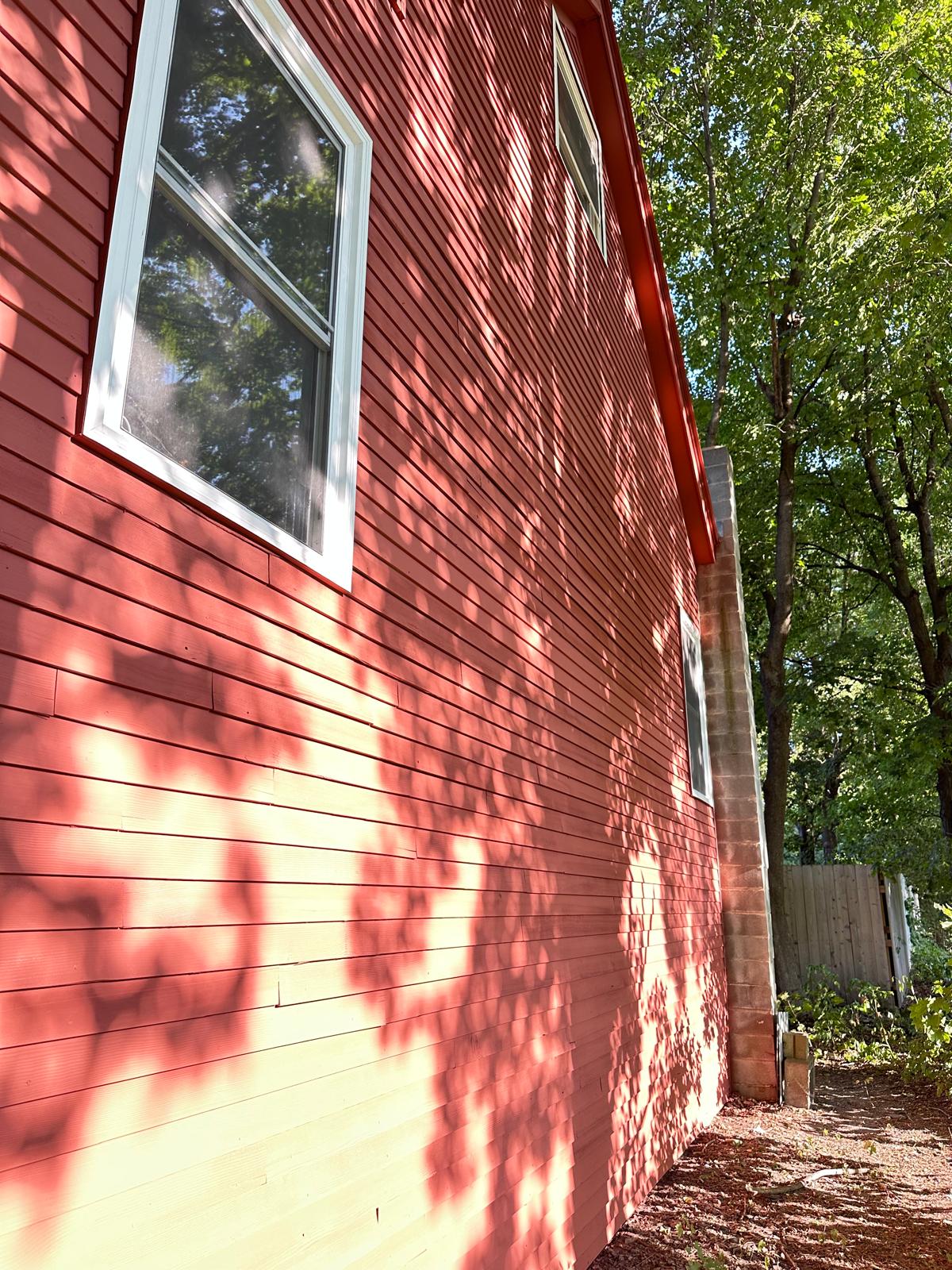 Fence staining project with uniform natural wood tone