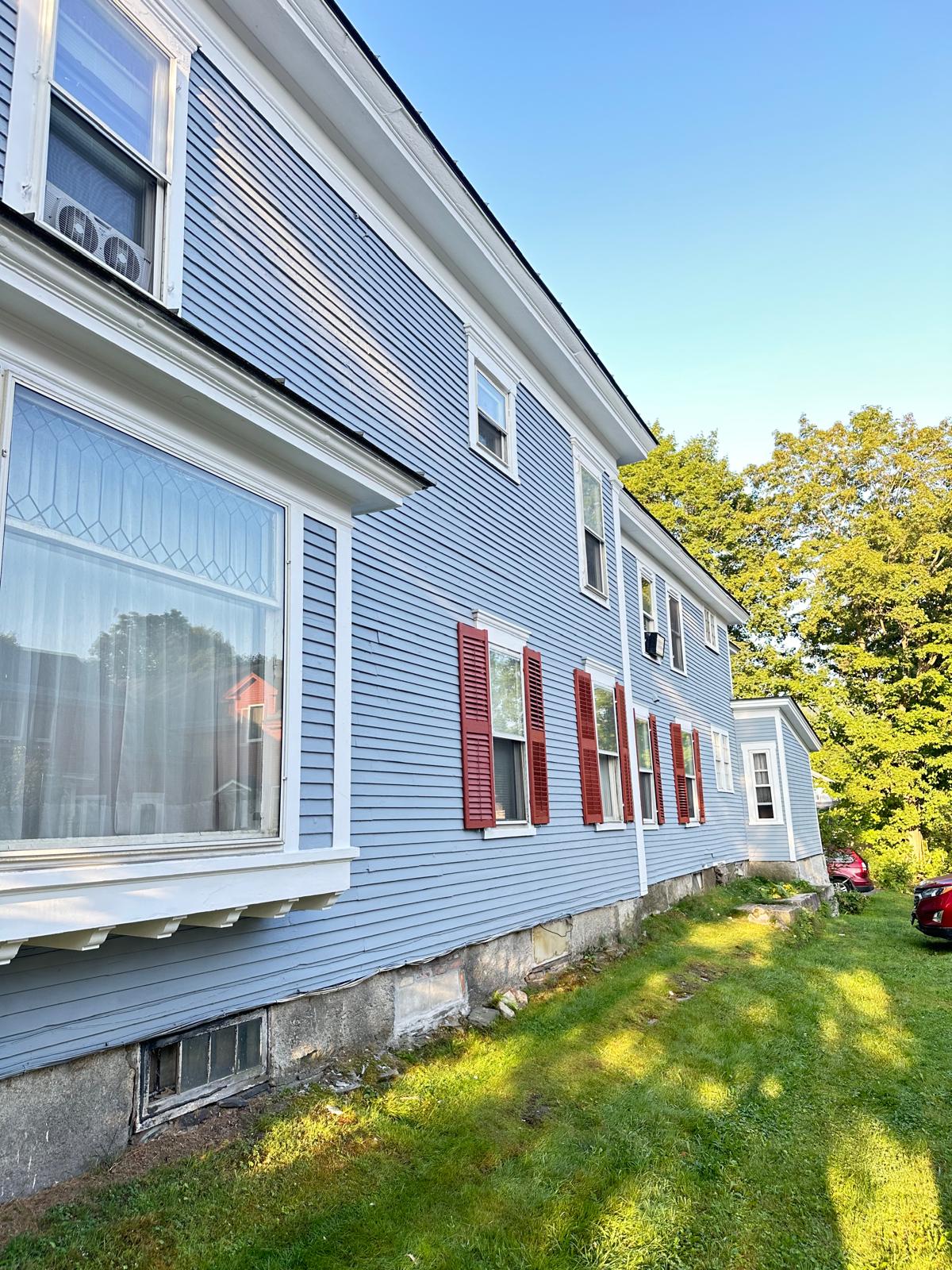 Fence staining project with uniform natural wood tone