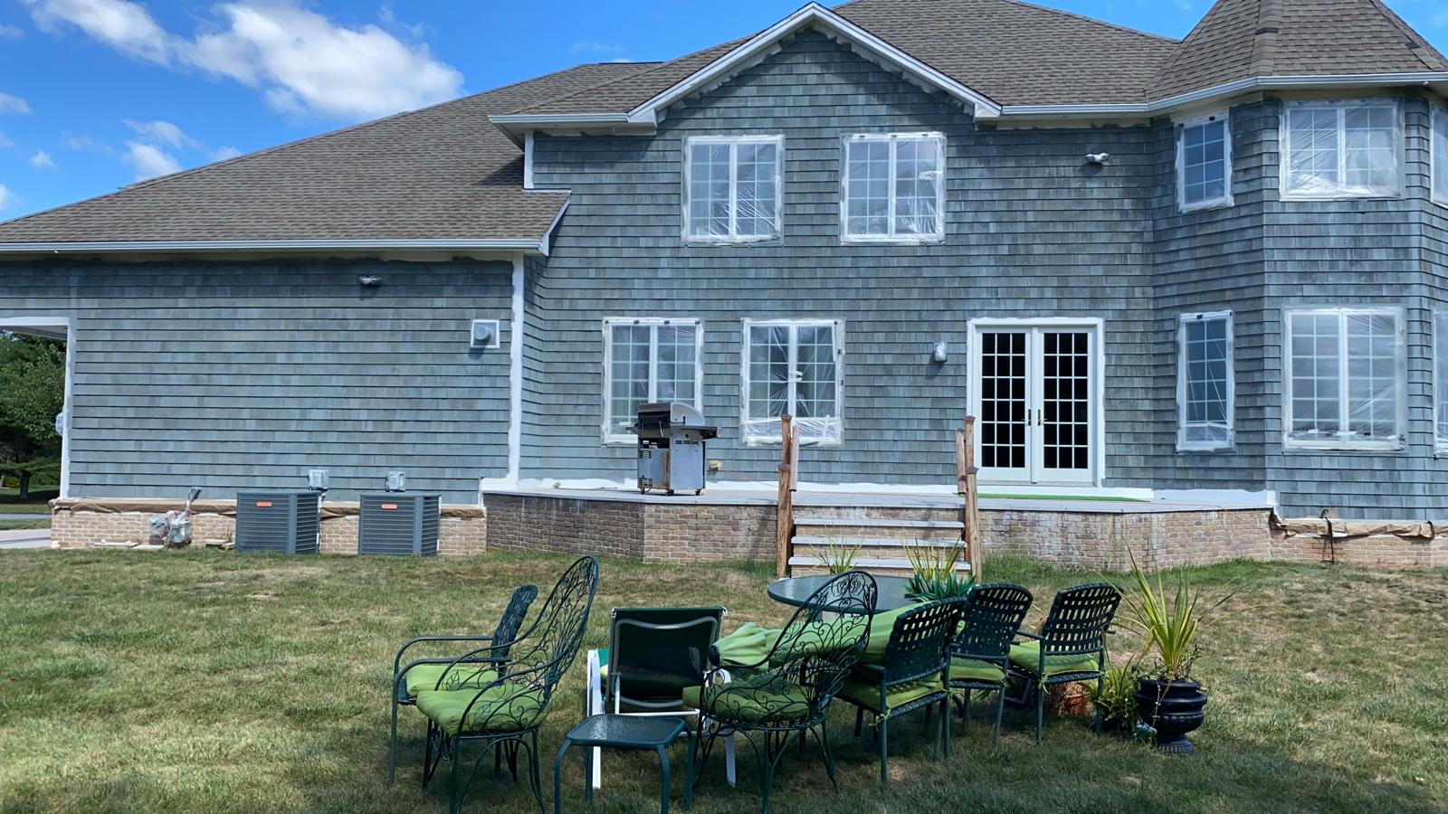 Fence staining project with uniform natural wood tone