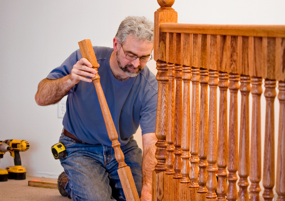 Carpentry repairs on a porch and railings