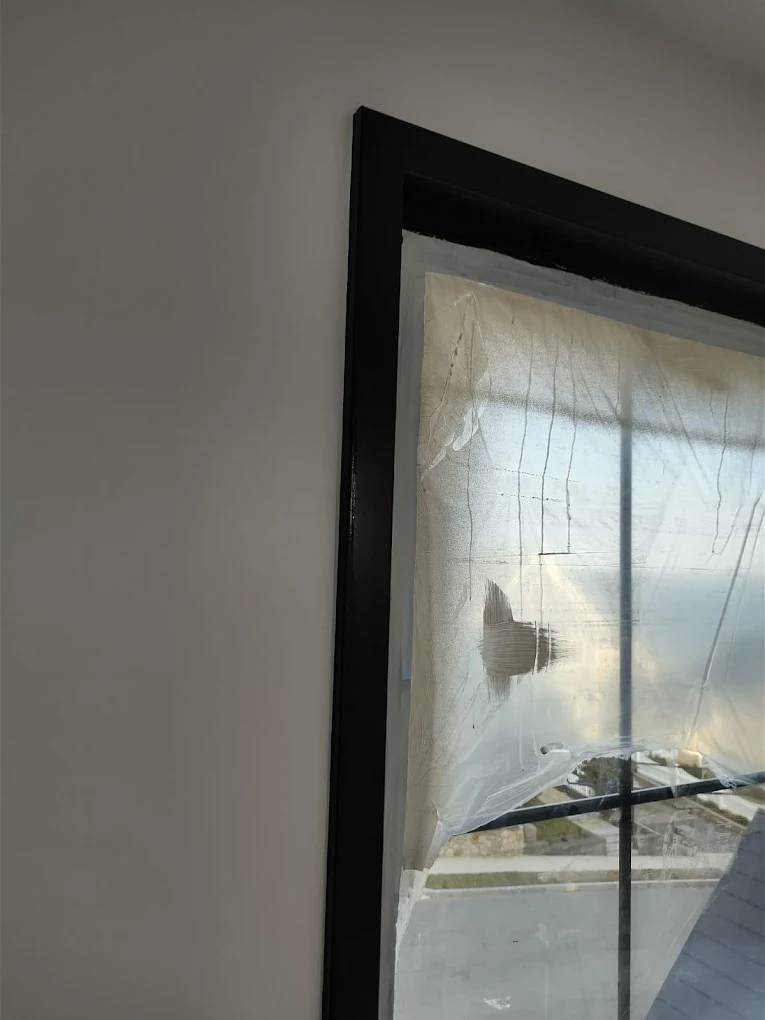 Freshly painted white trim and doors in a hallway